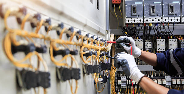 Professional Electrician technician working in Highland Beach, FL